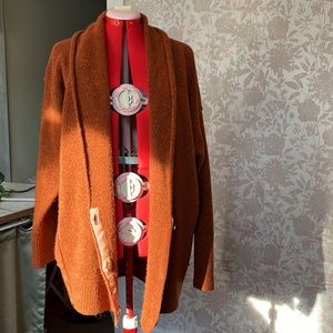 Free People cozy burnt orange cocoon wrap oversized sweater stylish comfort